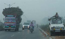 Light fog engulfs the Amritsar-Jalandhar highway on Thursday morning