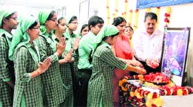 Students pay tributes to Maharishi Valmiki on the eve of his birth anniversary at Green Land Senior Secondary Public School in Ludhiana