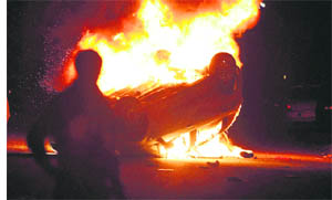 Garbage crisis: A car burns after clashes between the police and demonstrators near Naples on Friday. The clashes highlighted the latest garbage crisis in the area around Naples in southern Italy. 