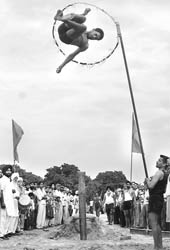 An artiste performs a stunt during the two-day Virasat Mela organised by the Punjab Virsa Cultural and Welfare Society at Dasehra ground in Mohali on Saturday
