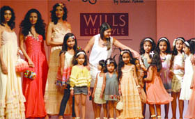 Kids walk the ramp with models for designer Pallavi Mohans show, Not So Serious, on the opening day of the Wills Lifestyle India Fashion Week at Pragati Maidan in New Delhi on Saturday.