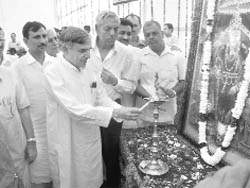 Union Water Resources Minister Pawan Kumar Bansal lights a lamp to inaugurate the 20th annual mela in Agroha near Hisar on Saturday.