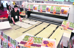 Zheng Fa Sheng, an engineer from China, exhibits his printing machine at Print Art 2010 in Ludhiana on Saturday.