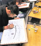 PAU students make cartoons during the PAU youth festival in Ludhiana on Saturday.