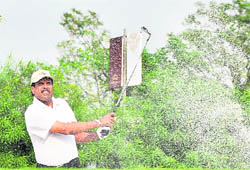 Former cricketer Kapil Dev plays a shot after inaugurating a golf course in Ludhiana on Saturday.