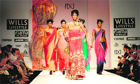 Models display creations of Indian designer Kavita Bhartia during The Wills Lifestyle India Fashion Week  Spring Summer 2011 at Pragati Maidan in New Delhi on Sunday. The fashion week ends October 27. Fashion Design Council of India claims this event to be the biggest ever fashion bash in the country with 115 designers taking part this year. 