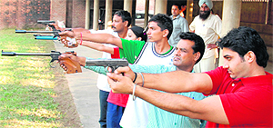 Players take aim during the Chandigarh State Shooting Championship in Sector 25, Chandigarh, on Sunday.