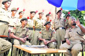 ACP Bhpinder Singh (first from right) informs NCC cadets about the working of police stations in Ludhiana on Sunday.