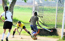 Players in action during the inter-district hockey tournament being played at the Punjab Agricultural University campus, Ludhiana, on Sunday.
