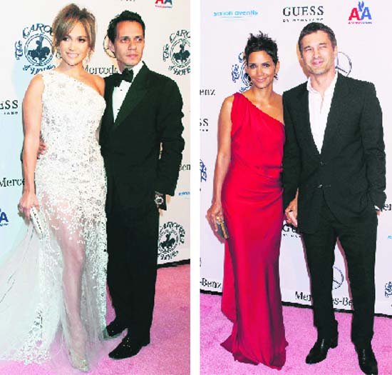 L-R: Actor Jennifer Lopez and husband, singer Marc Anthony, actor Halle Berry and boyfriend Olivier Martinez arrive at the Carousel of Hope Ball in Beverly Hills, California on Saturday night