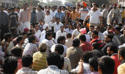 Residents of Makhu with representatives of different organisations blocking traffic on Ferozepur-Amritsar national highway to lodge protest against the killing of seven-year-old Hardik (inset) in Ferozepur on Sunday.