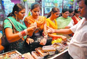 Women choosing bangles on the eve of Karva Chauth in Bathinda