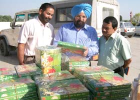 Civil Surgeon Dr KJS Kakkar examines the sweets seized during a raid near Abohar