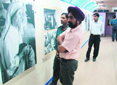 Visitors at a painting exhibition on the train on Monday.