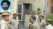 Cops outside the Sarita Vihar house of the couple.