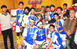 The Jammu and Kashmir team with the senior wing trophy of the All-India Invitational Roller Skating Championship in Mussoorie on Sunday.