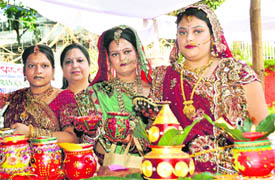 Women participate in a competition on the eve of Karva Chauth in Dehradun on Monday.