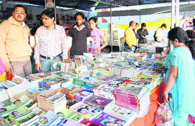 Visitors at a book fair during the Uttarakhand Trade Mahotsav in Dehradun on Monday.