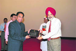 Lt-Gen RS Sujlana, Commandant, IMA, presents a memento to Union minister Kamal Nath in Dehradun on Monday. 