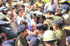 Statehood agitators jostle with police personnel in front of the Secretariat in Dehradun on Monday. 