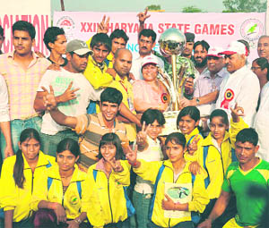 Education and Health Minister Geeta Bhukkal with winners of Rohtak at the 24th State Games in Faridabad.