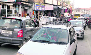 A traffic jam at Kotwali Bazaar in Dharamsala on Monday