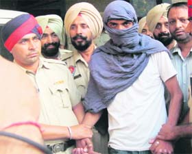 Accused Sukhjinder Singh is taken to the Makhu police station