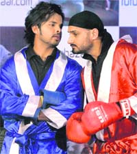 S Sreesanth (L) and Harbhajan Singh in boxing gloves during a promotional event in Mumbai