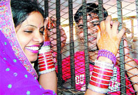 A newlywed couple shares some happy moments on the occasion of Karva Chauth in the Amritsar Central Jail on Tuesday.