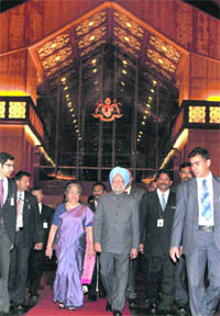 Prime Minister Manmohan Singh along with his wife Gursharan Kaur arrives at Kuala Lumpur International Airport in Malasiya on Tuesday