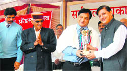 President of the Sarvakalyankari Sabha Rajinder Rana honours Dr Raj Bahadur (second from right), Director- Principal, Government Medical College and Hospital,Chandigarh, before the start of a mega medical camp at the primary health centre, Sujanpur Tihra, on Sunday. Thousands of patients were examined by a team of doctors headed by Dr Raj Bahadur and medicines worth `10.8 lakh distributed free of cost.