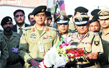 Director-General of the BSF Raman Srivastva (right) being welcomed by Pakistan Rangers Brigadier Farukh Jamal after the BSF delegation crosses over to Pakistan via Attari-Wagah joint check post on Tuesday. 