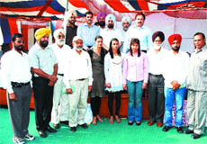 Punjab Basketball Association president and former DGP Rajdeep Singh Gill honours Commonwealth Games medallists at a function in the Punjab Police Academy, Phillaur. 
