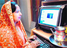 A woman in Haridwar breaks her fast after seeing her husband online on Tuesday. 