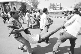 Telangana activists being stopped by security personnel from holding aprotest during the Andhra Pradesh Foundation Day celebrations in Hyderabad on Tuesday. 