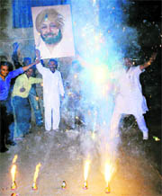 Congress workers celebrate the appointment of Capt Amarinder Singh as the PPCC President, in Patiala on Tuesday.
