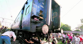 Engineers work on Tata Moori which derailed in Jalandhar on Tuesday.