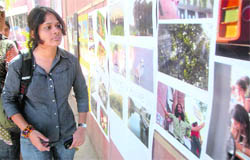 A girl sees photographs being exhibited at Soch-2010, the annual media fest of the School of Communication Studies, Panjab University, Chandigarh,
