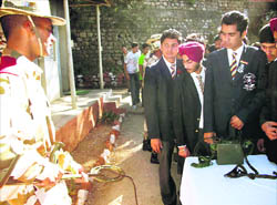 An ITBP personnel explains the use of metal detector to students from Guru Nanak School in Mussoorie on Wednesday. 
