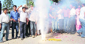 Congress workers celebrate the re-appointment of Yashpal Arya as Uttarakhand Congress chief in Dehradun on Wednesday.