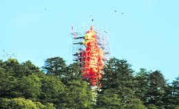 Work in progress on Lord Hanuman's sculpture at Jakhu Hill in Shimla on Wednesday.