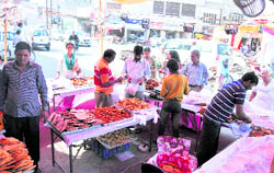 Vendors put up stalls on roads