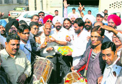 Congress workers celebrate in Ludhiana on Wednesday