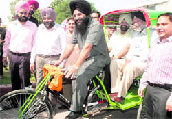 Patiala District Planning Committee chairman Surjit Singh Rakhra and Divisional Commissioner GS Grewal during a ride on Wednesday