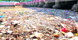 Heaps of garbage lying under the Damkoti twin bridges.