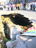 The road that caved in near the railway overbridge on the Jhajjar road in Rohtak 