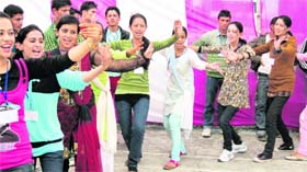 Students perform a dance at the youth festival in a Dhaliara college