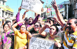 BJP activists hold a protest against the visit of the interlocutors at Kachhi Chawani in Jammu on Thursday