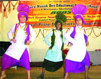 Students of the Guru Nanak Dev Eductional Society perform bhangra during a function in Amritsar