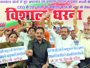 Bharatiya Janata Party activists hold a demonstration, demanding the removal of Prasar Bharti CEO B.S. Lalli, at Jantar Mantar in New Delhi on Friday.